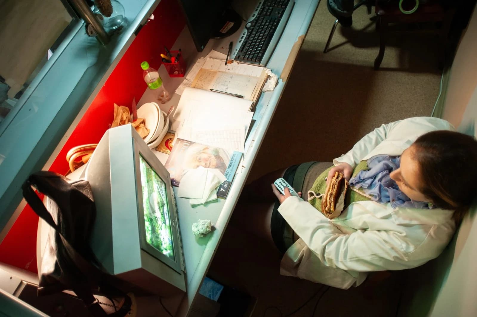 Holy Smear set: a nurse at a desk in the hospital ward, seen from above