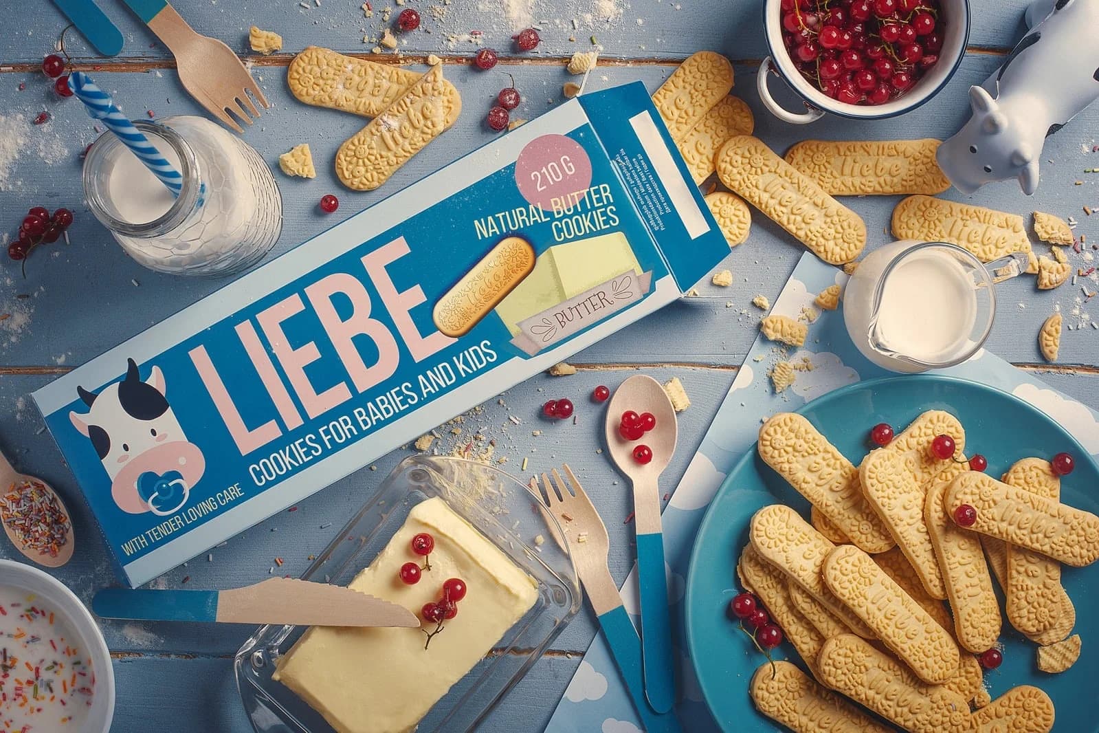 Liebe biscuits flat lay with the pack, butter and berries